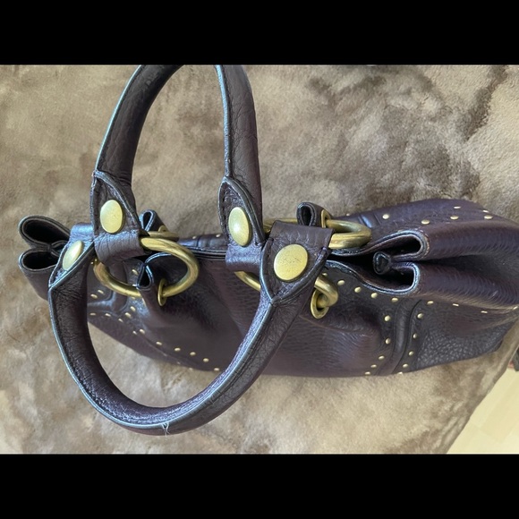 Kenneth Cole Purple Thick
Pebble Leather Studs Satchel Handbag
Purse PRE-OWNED - Picture 10 of 11